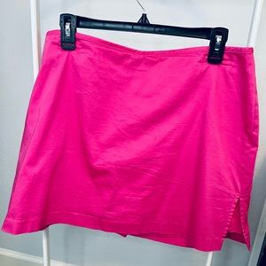 Golf skort. Size 14. Dark pink. Brand name is identified  by a graphic (see tag)